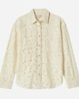 An off white lacey button up long sleeve top. 