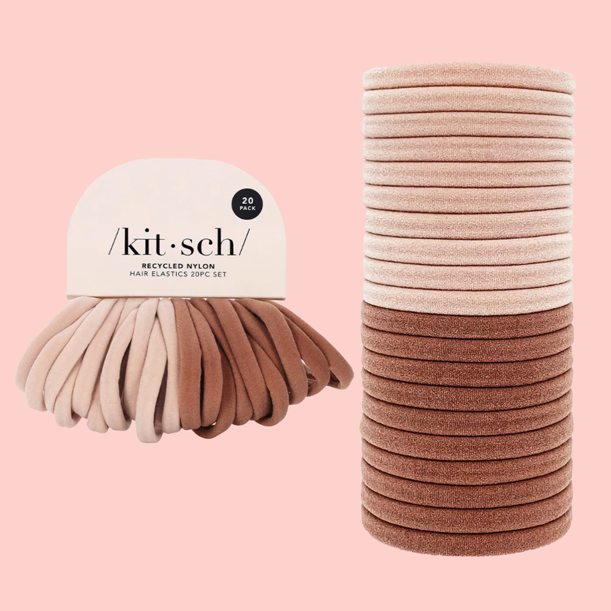 A stack of round recycled nylon elastic hair ties in a light pink shade and a slightly darker blush pink shade.