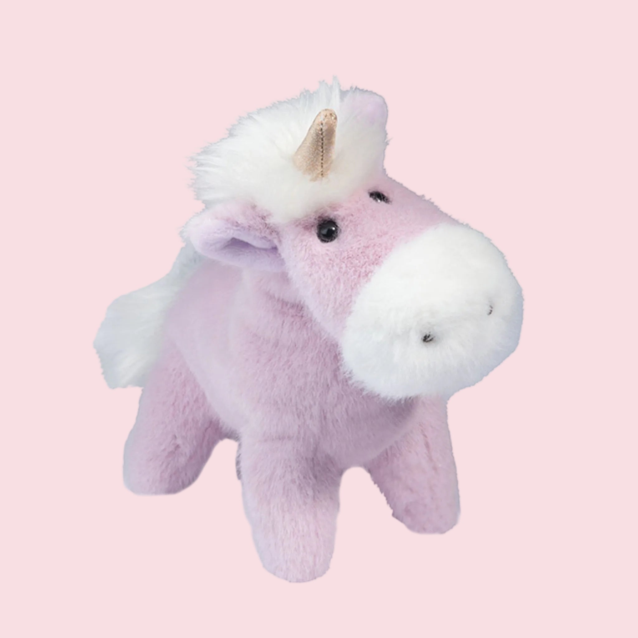 A light purple/pink unicorn shaped stuffed animal. 
