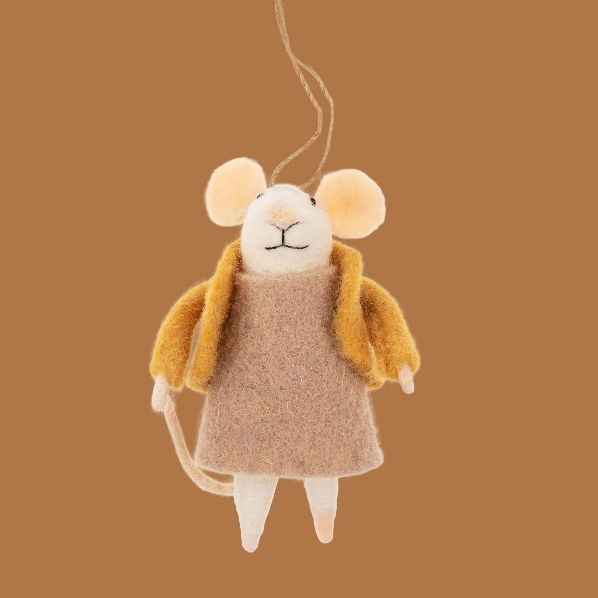 A mouse shaped ornament wearing a tan dress and yellow jacket. 