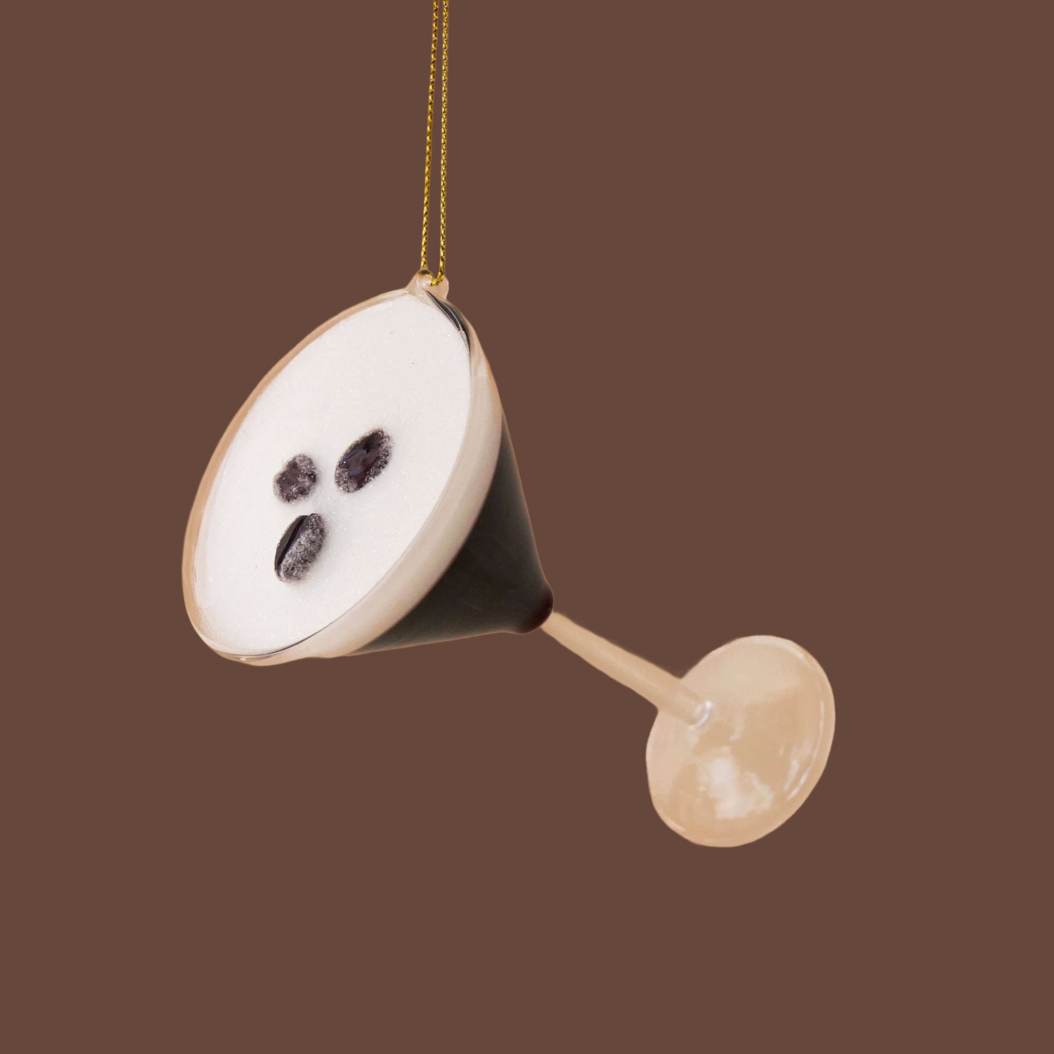 Espresso martini glass ornament, with three espresso beans on the top of the drink. 