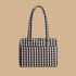 A black and cream gingham everyday cloud bag.