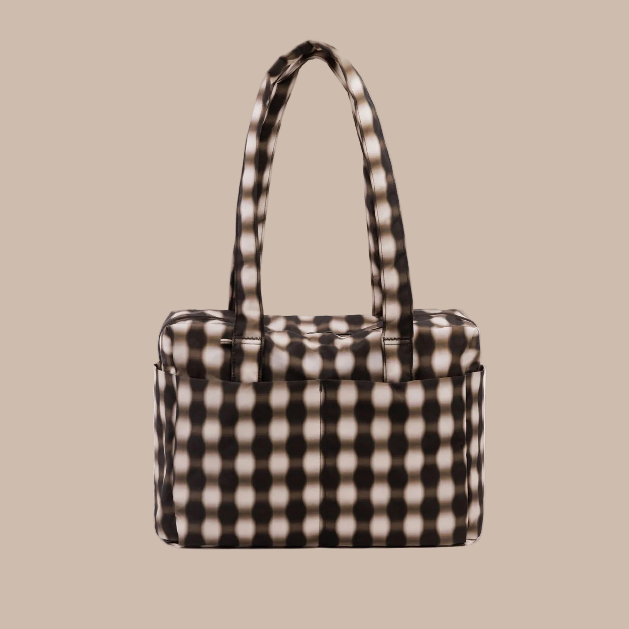 A brown, tan and black blurred gingham print. 