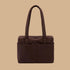 A coffee colored nylon tote bag.