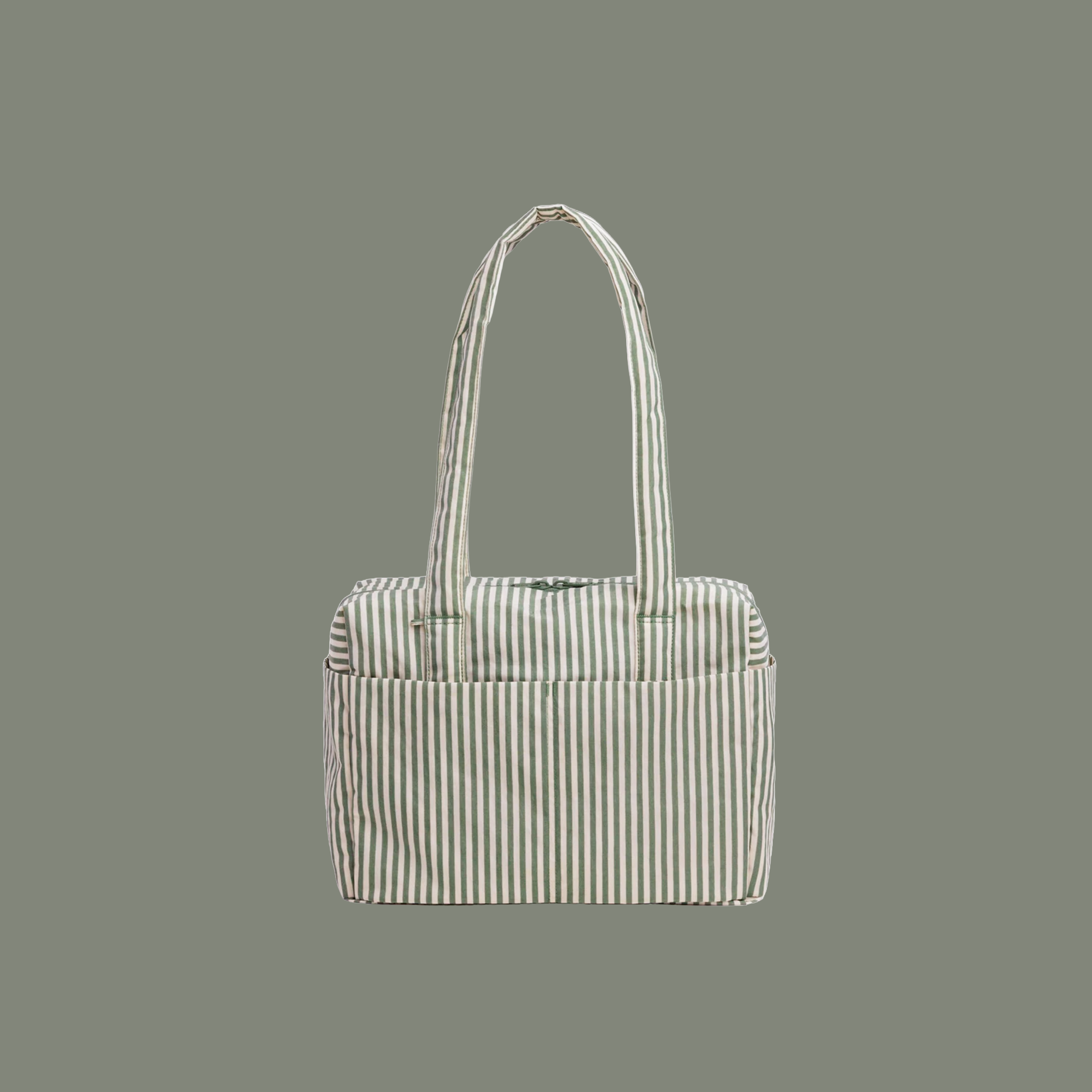 sage colored striped bag with sage colored straps on a sage colored ground.