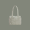 sage colored striped bag with sage colored straps on a sage colored ground.