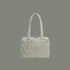 sage colored striped bag with sage colored straps on a sage colored ground.