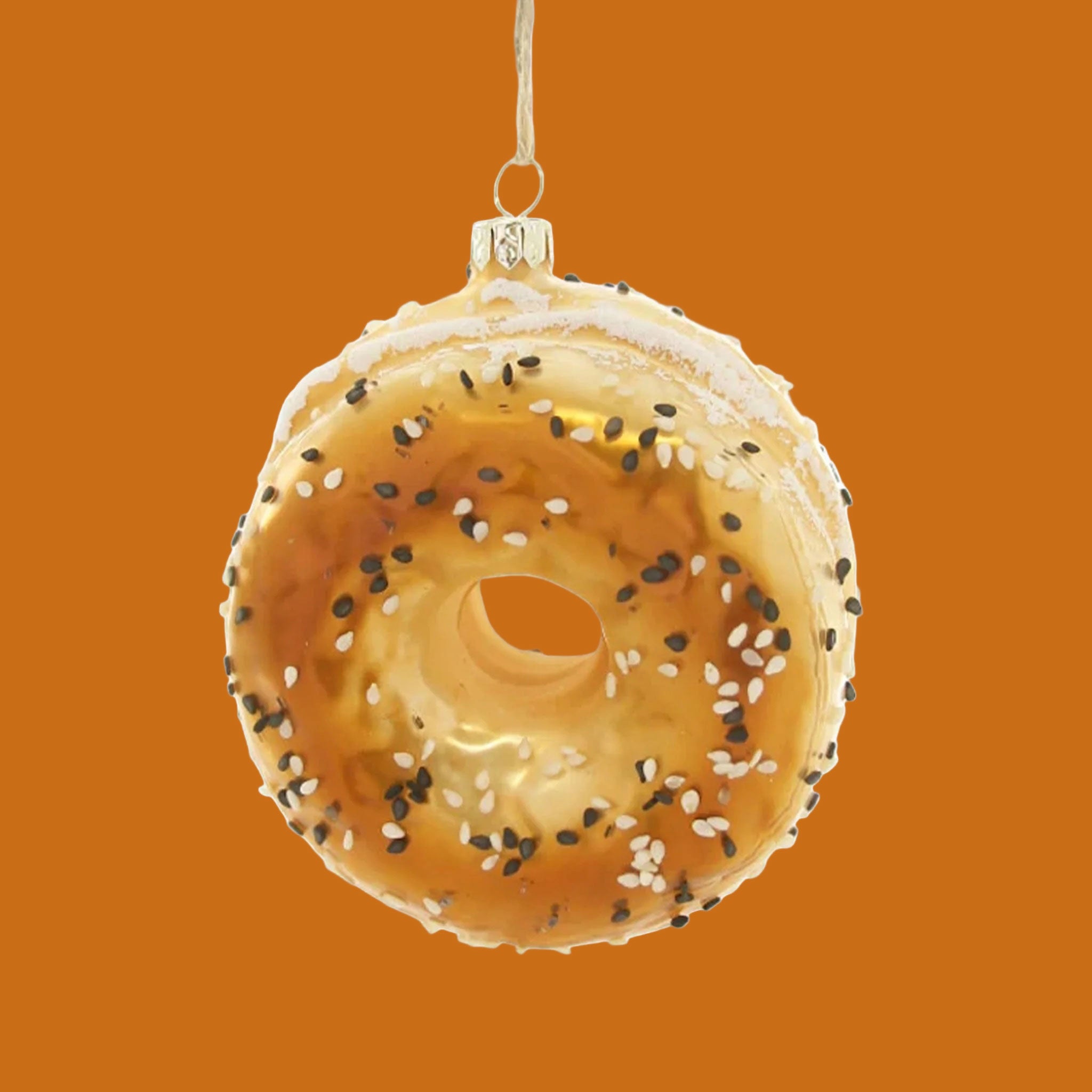 A glass everything bagel shaped ornament