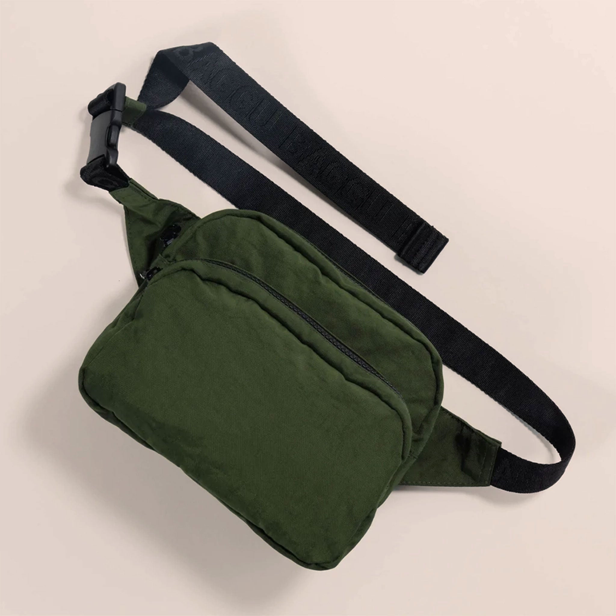 A dark green nylon fanny pack with two zipper pockets and a black adjustable strap.