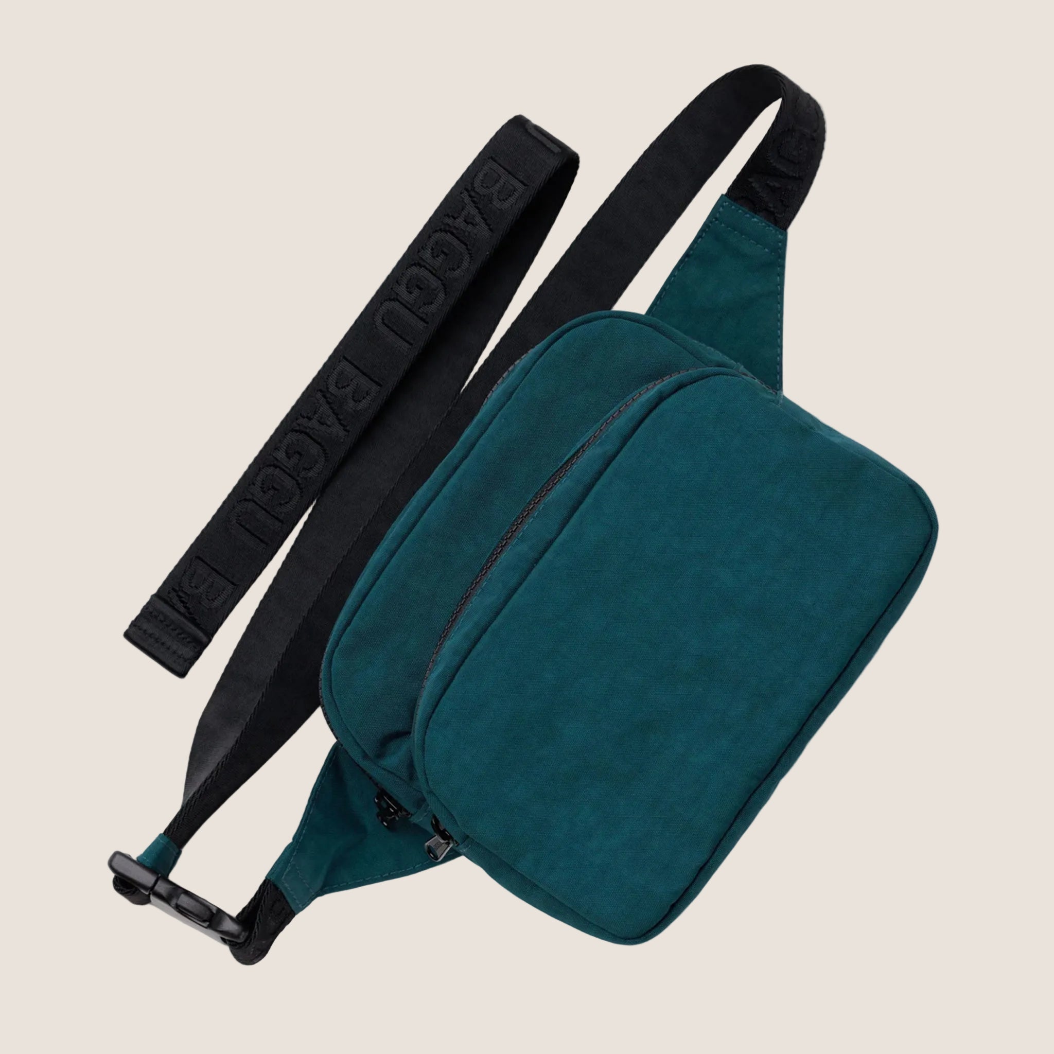 A dark teal and black nylon fanny pack. 