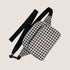 A black and white gingham nylon fanny pack with two zipper pockets and a black adjustable strap.