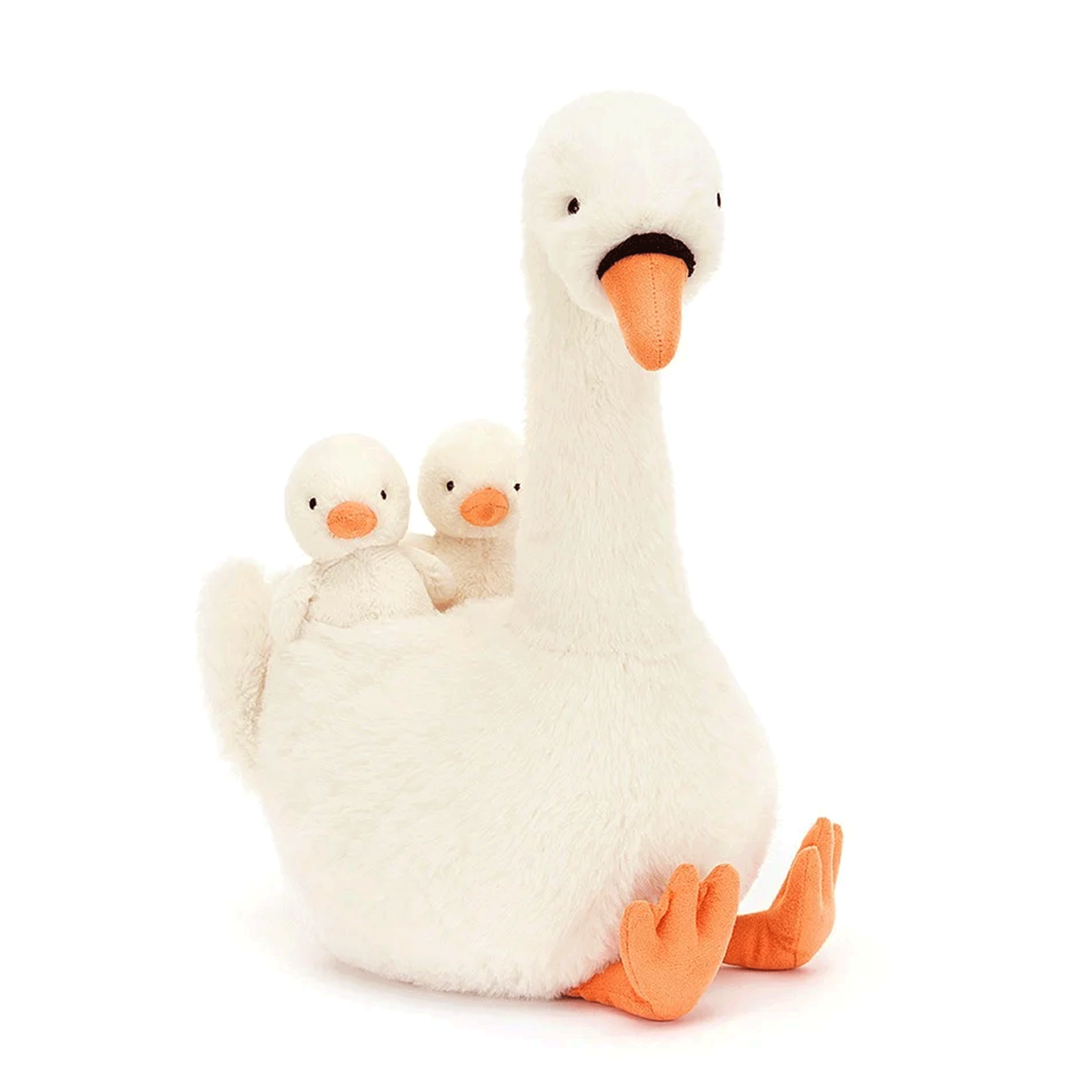 On a white background is a swan shaped stuffed animal toy with two baby swans on her back. 