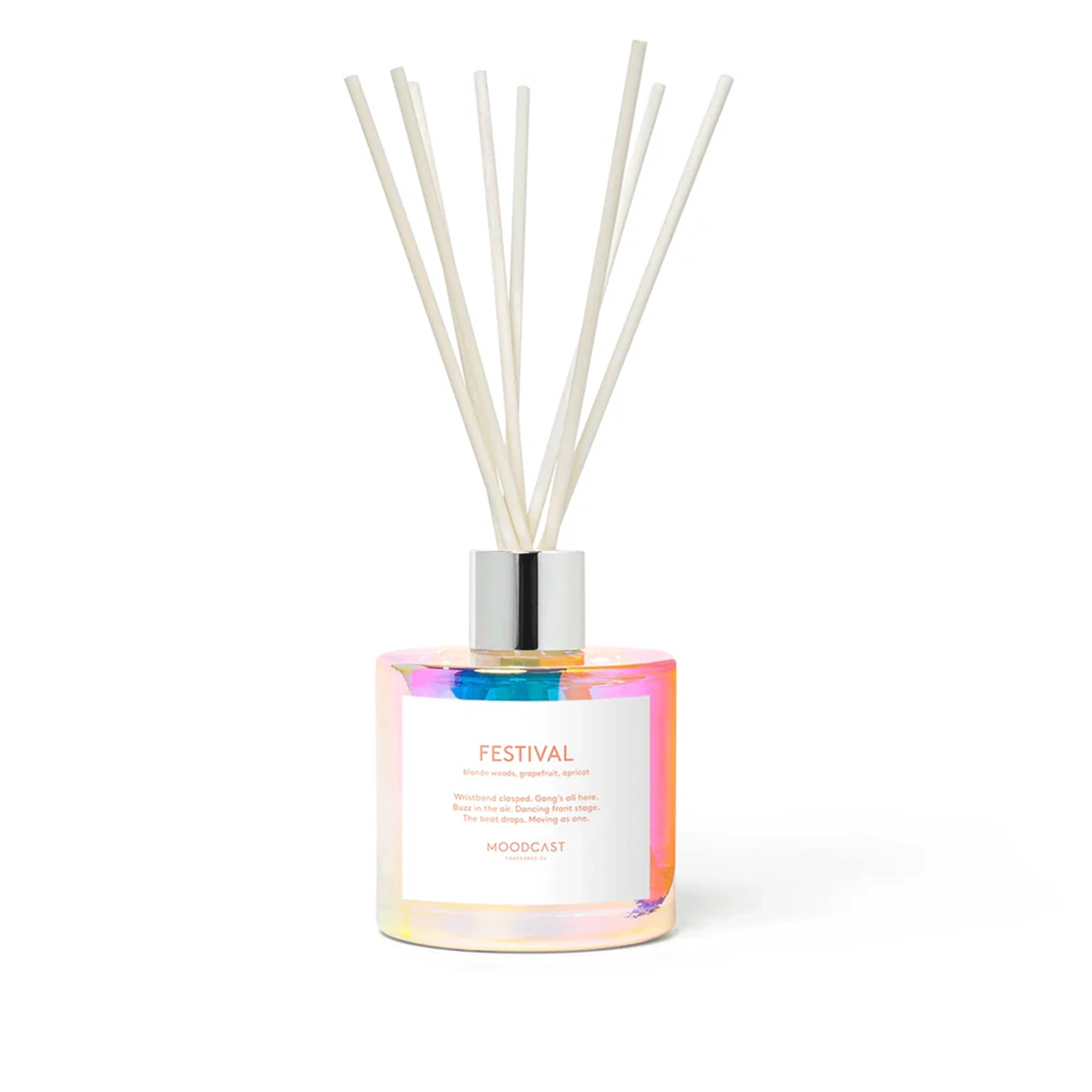 On a white background is a multi-colored glass container with reed diffusers.