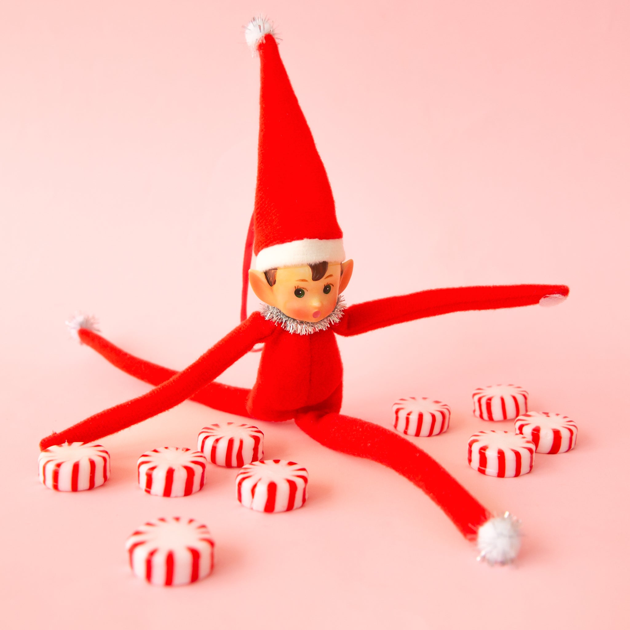 A red elf shaped ornament. 