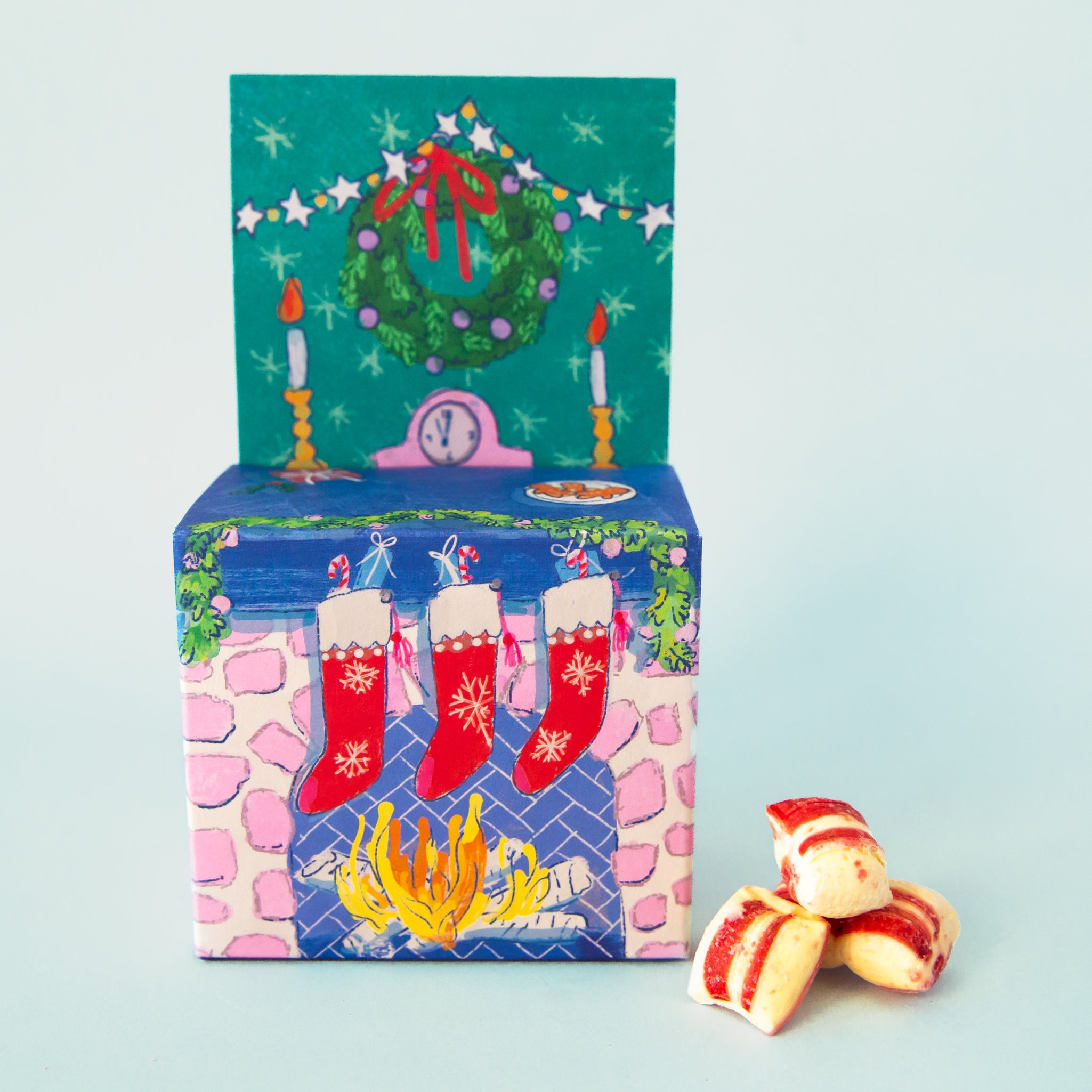 A fireplace shaped box of candies. 