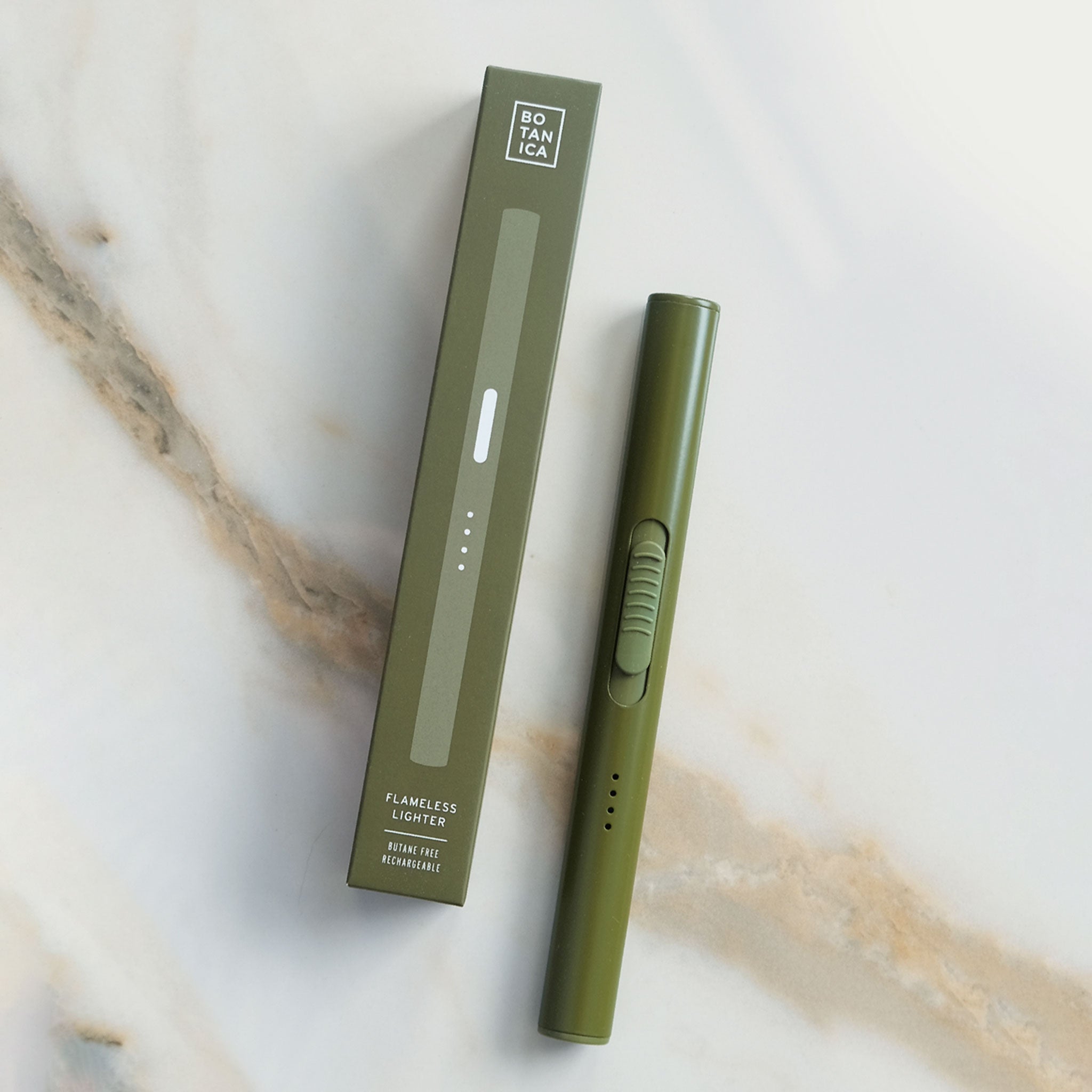 flameless lighter in olive green shown against a neutral marble background