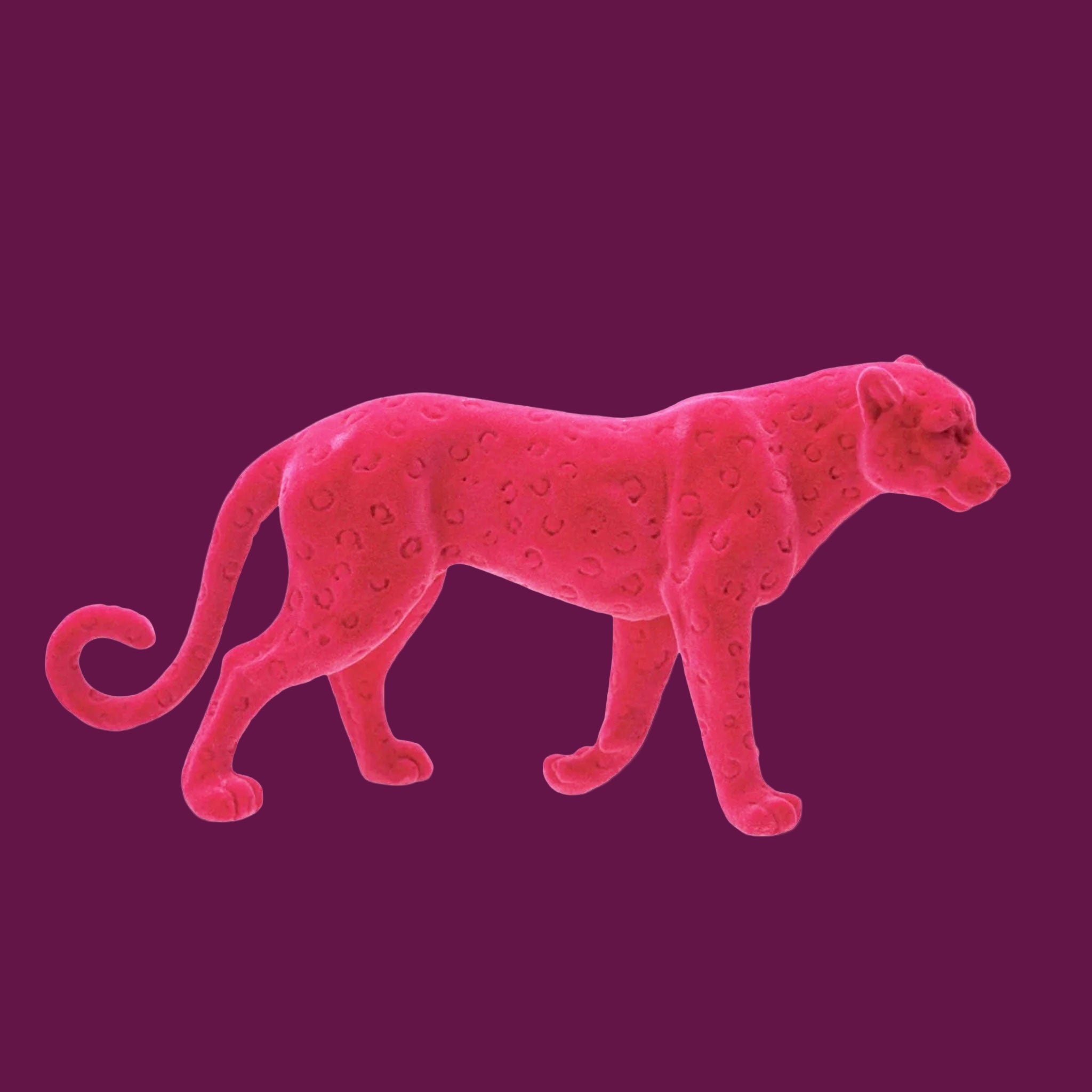 A pink flocked leopard shaped figurine. 