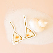 A triangle bikini top shaped sticker with orange florals. 