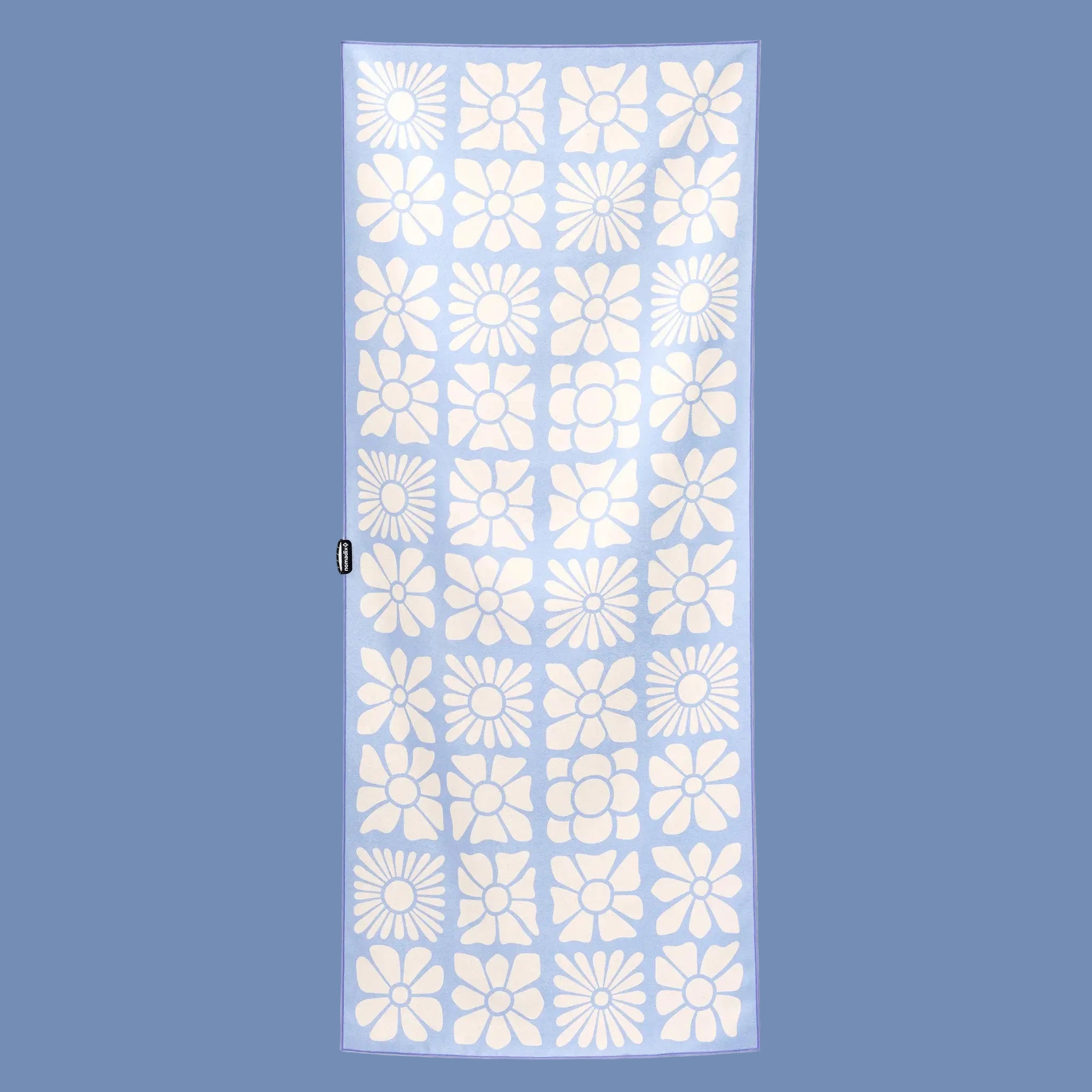 Towel with white floral pattern on a light blue background