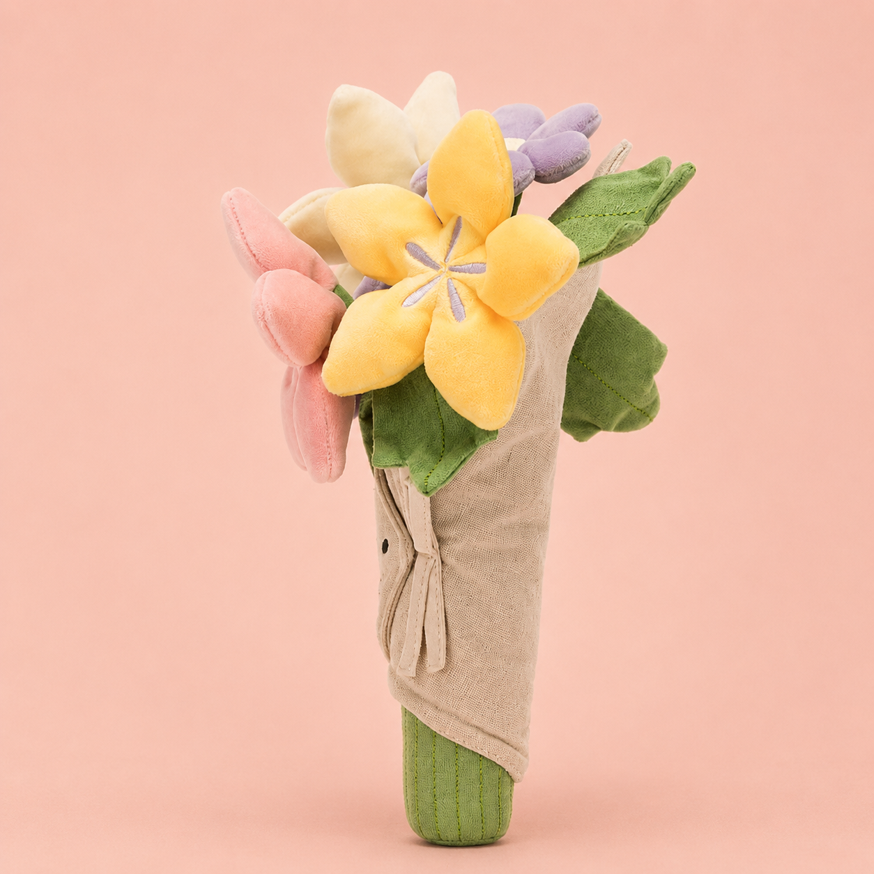 a plush toy bouquet of flowers with a smiling face. 