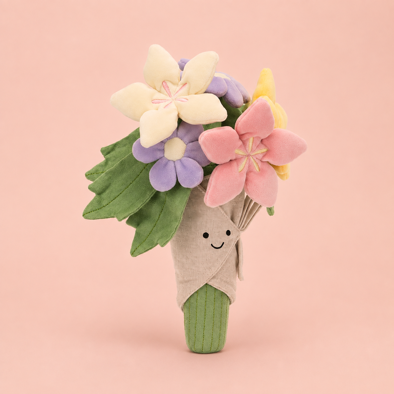 a plush toy bouquet of flowers with a smiling face. 