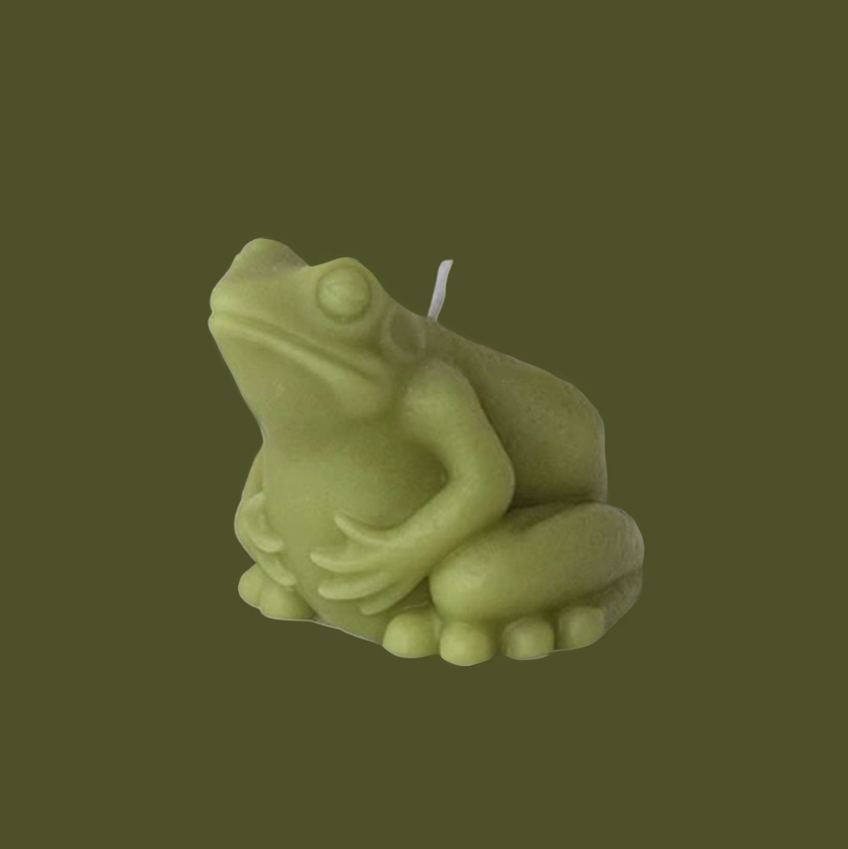 A green frog shaped candle. 