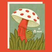 Greeting card with a mushroom and frog, the frog is holding a daisy. The card reads "Hi Mom". 