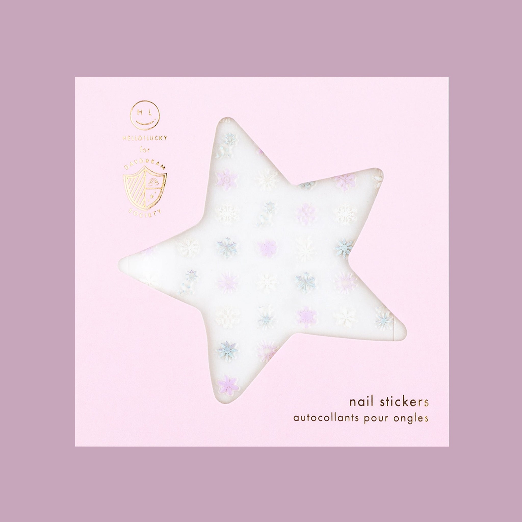 A light pinkish / purple pack of nail stickers in the shape of snowflakes. 