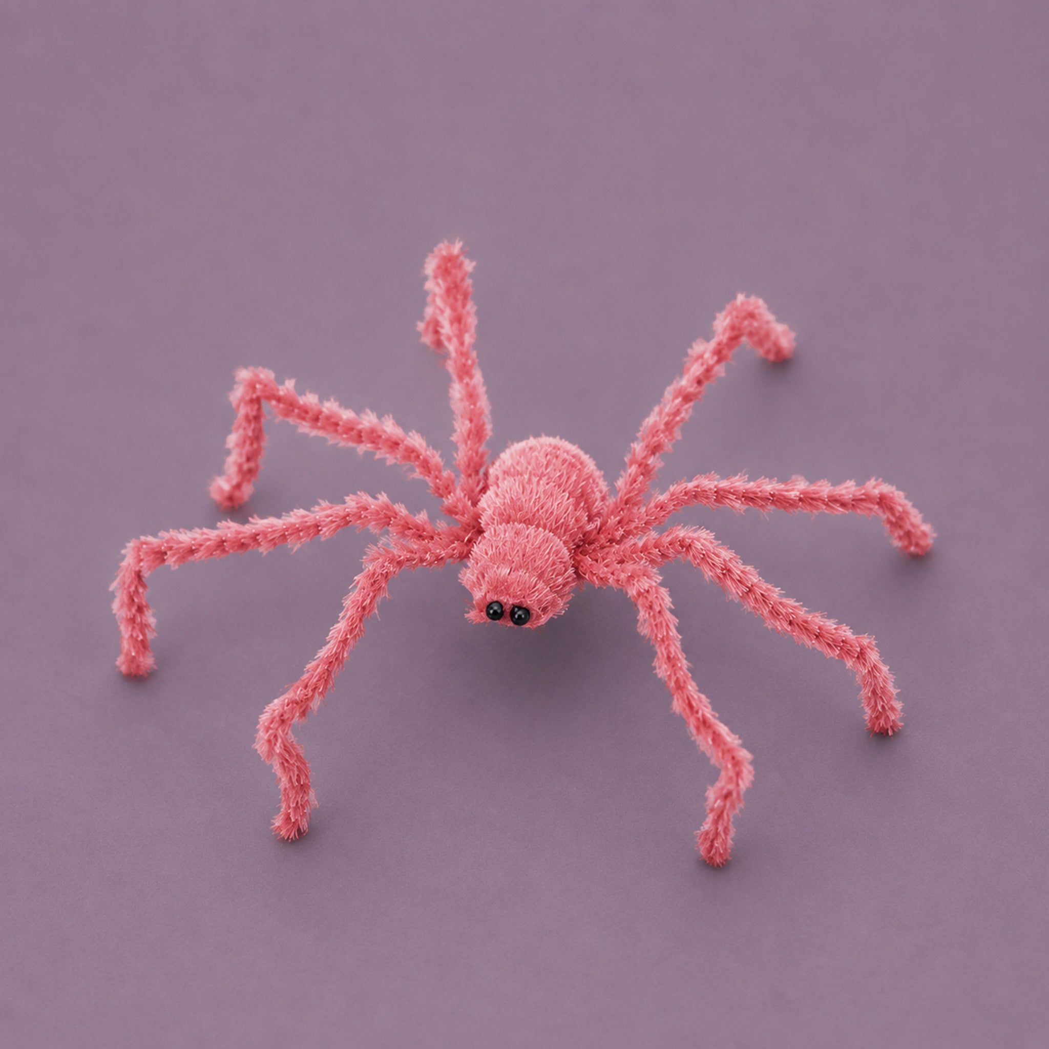 A pink furry spider decoration. 