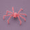 A pink furry spider decoration. 