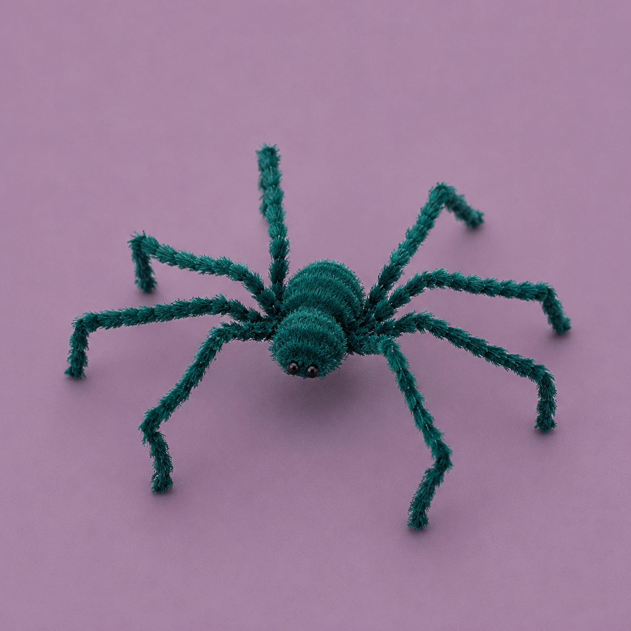 A teal spider halloween decoration. 