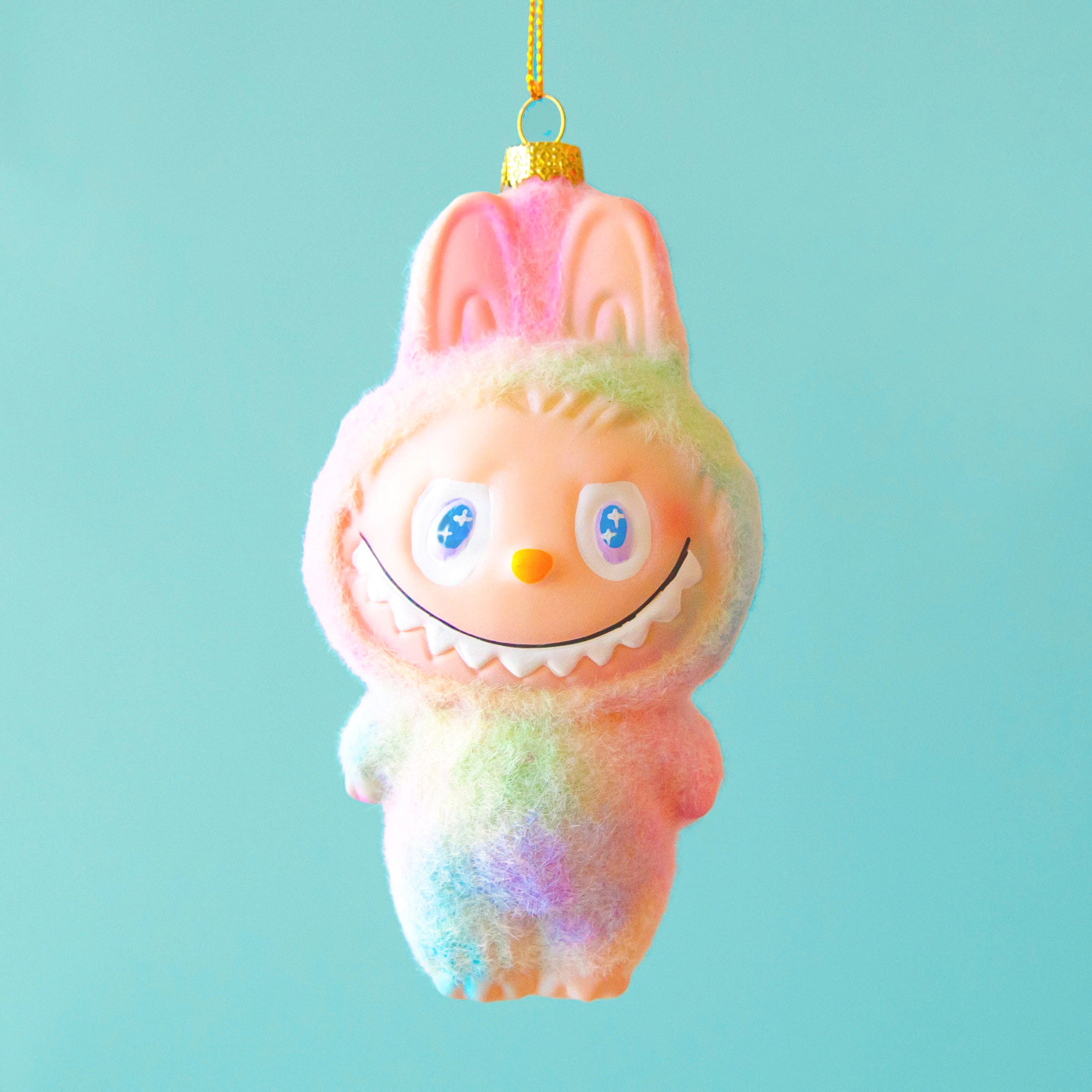 A rainbow fuzzy labubu shaped ornament. 