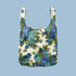 A blue rose floral motif printed on a reusable tote on a blue background.