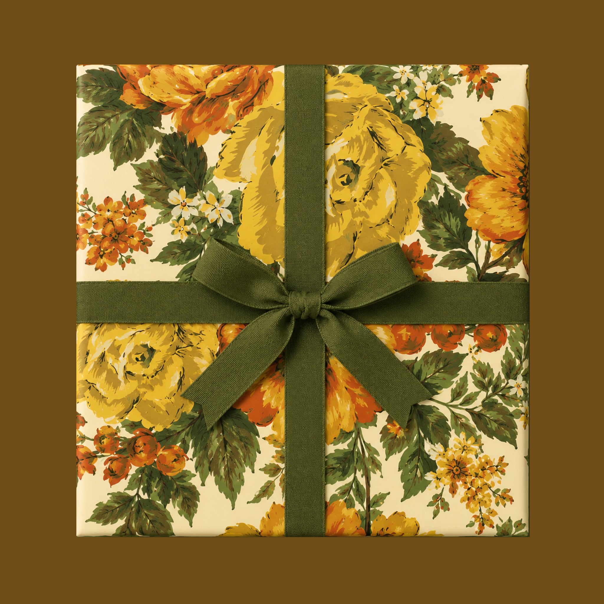 A present wrapped in a vintage yellow rose floral wrapping paper with green ribbon.