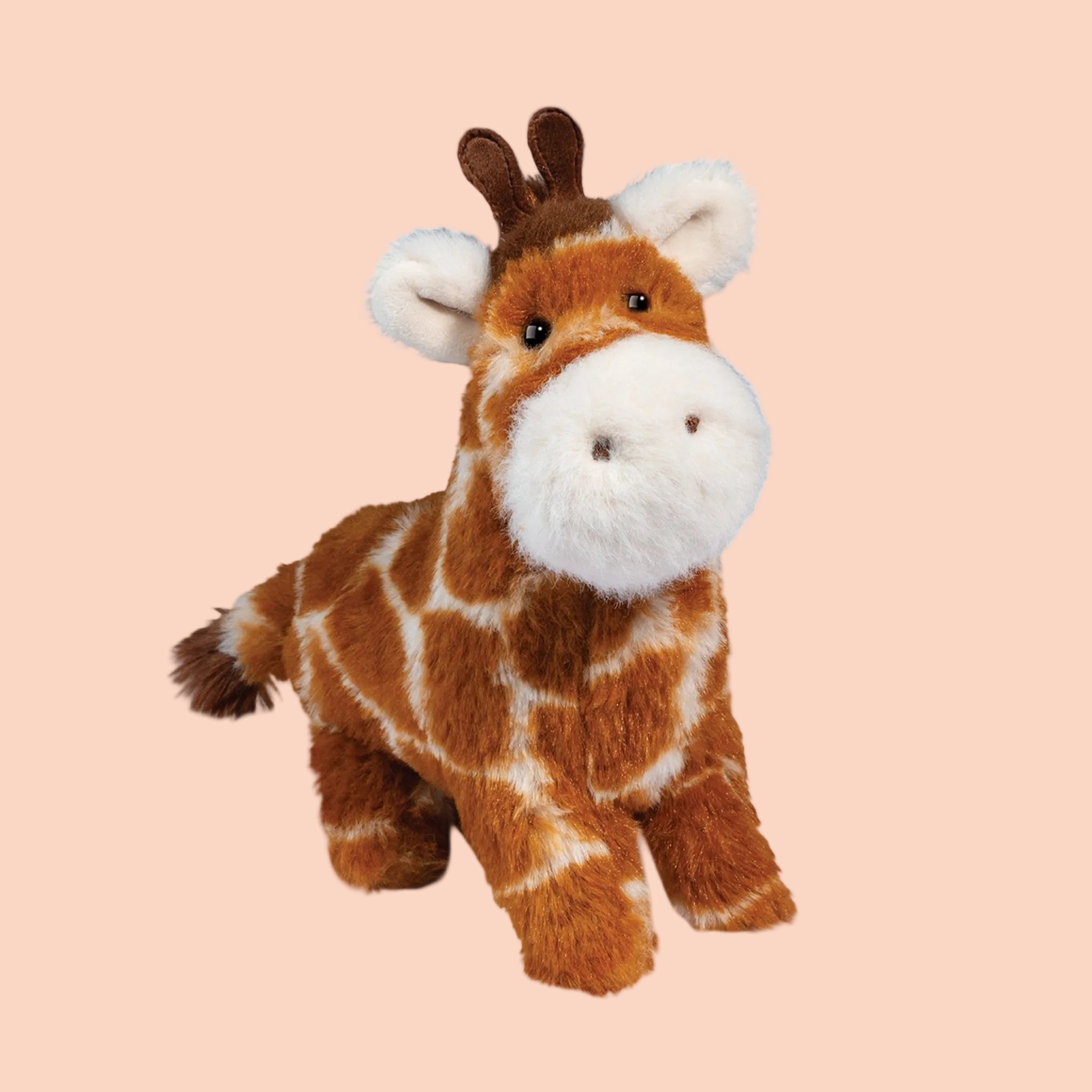 A giraffe shaped stuffed animal toy. 