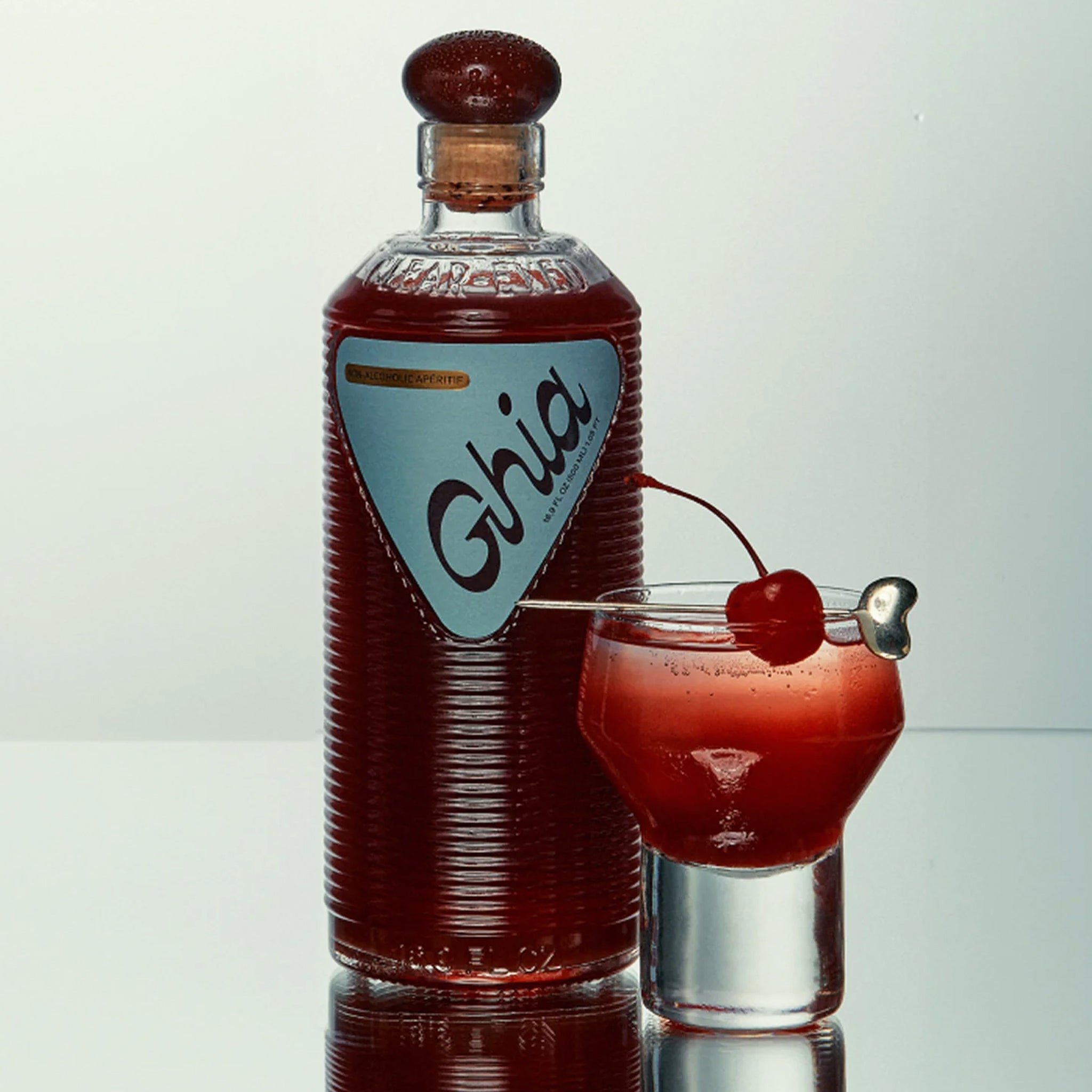 A bottle of apertif with a label that reads, "Ghia". 