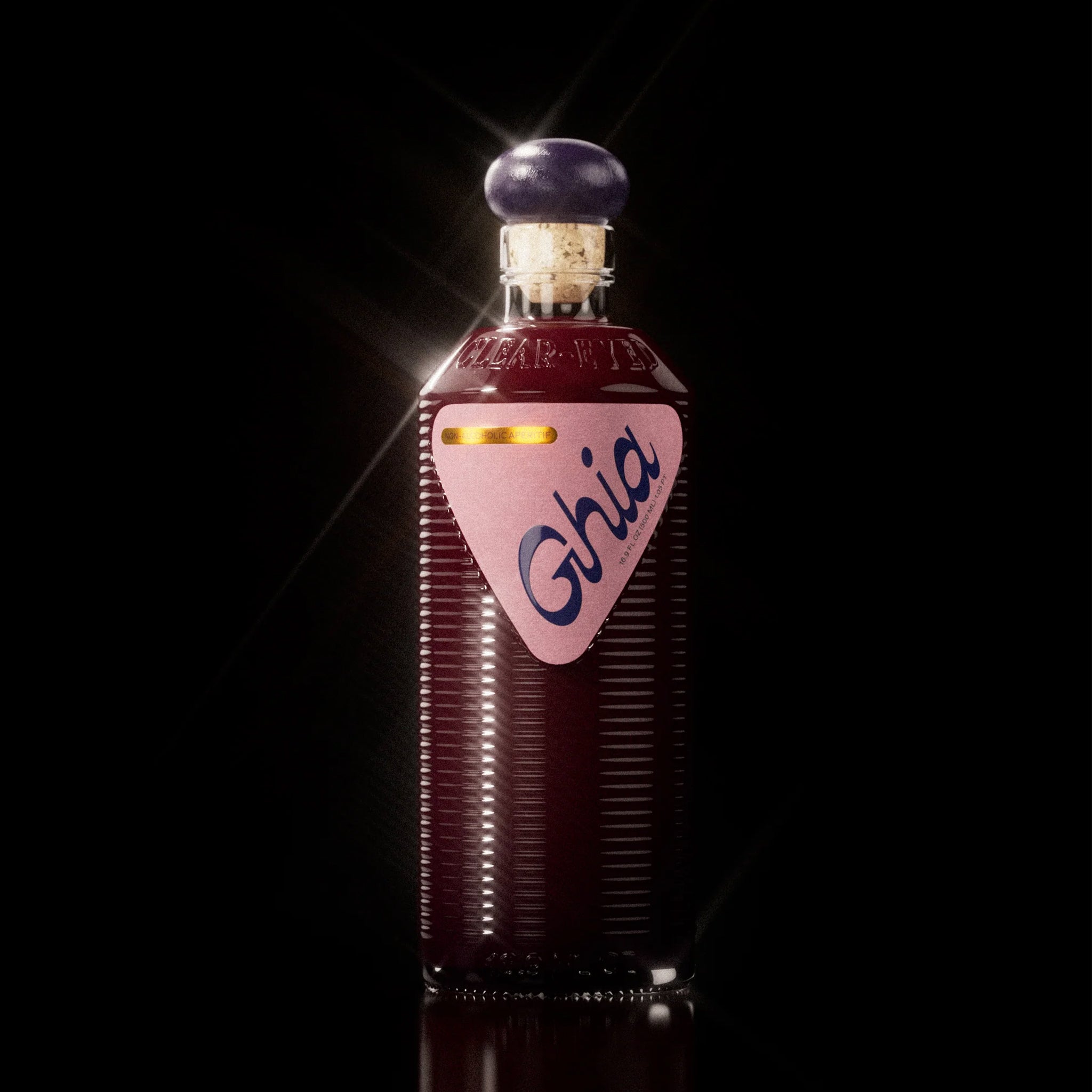 A bottle of berry flavored apertif with a label that reads, "Ghia". 