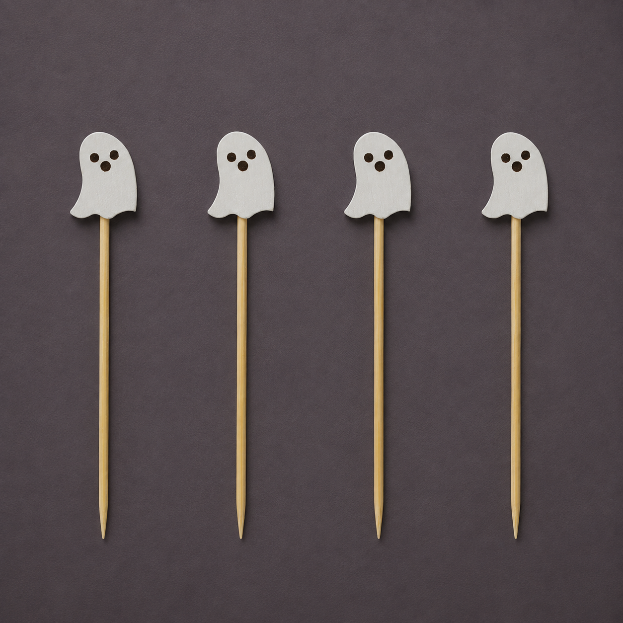 A set of ghost shaped bamboo toothpicks. 
