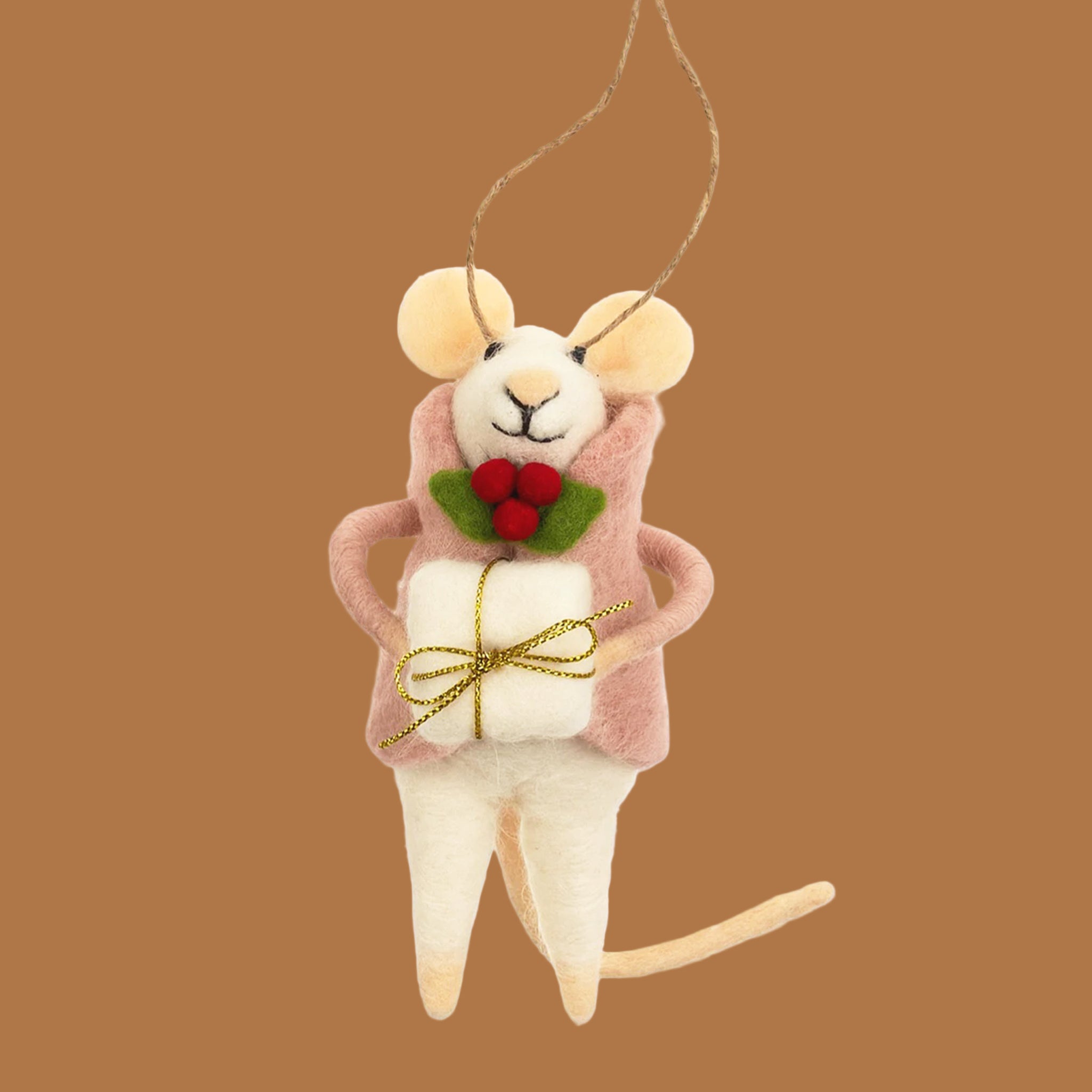 Mouse ornament with a pink coat on. She has a present in hand and has a holly berry on her coat. 