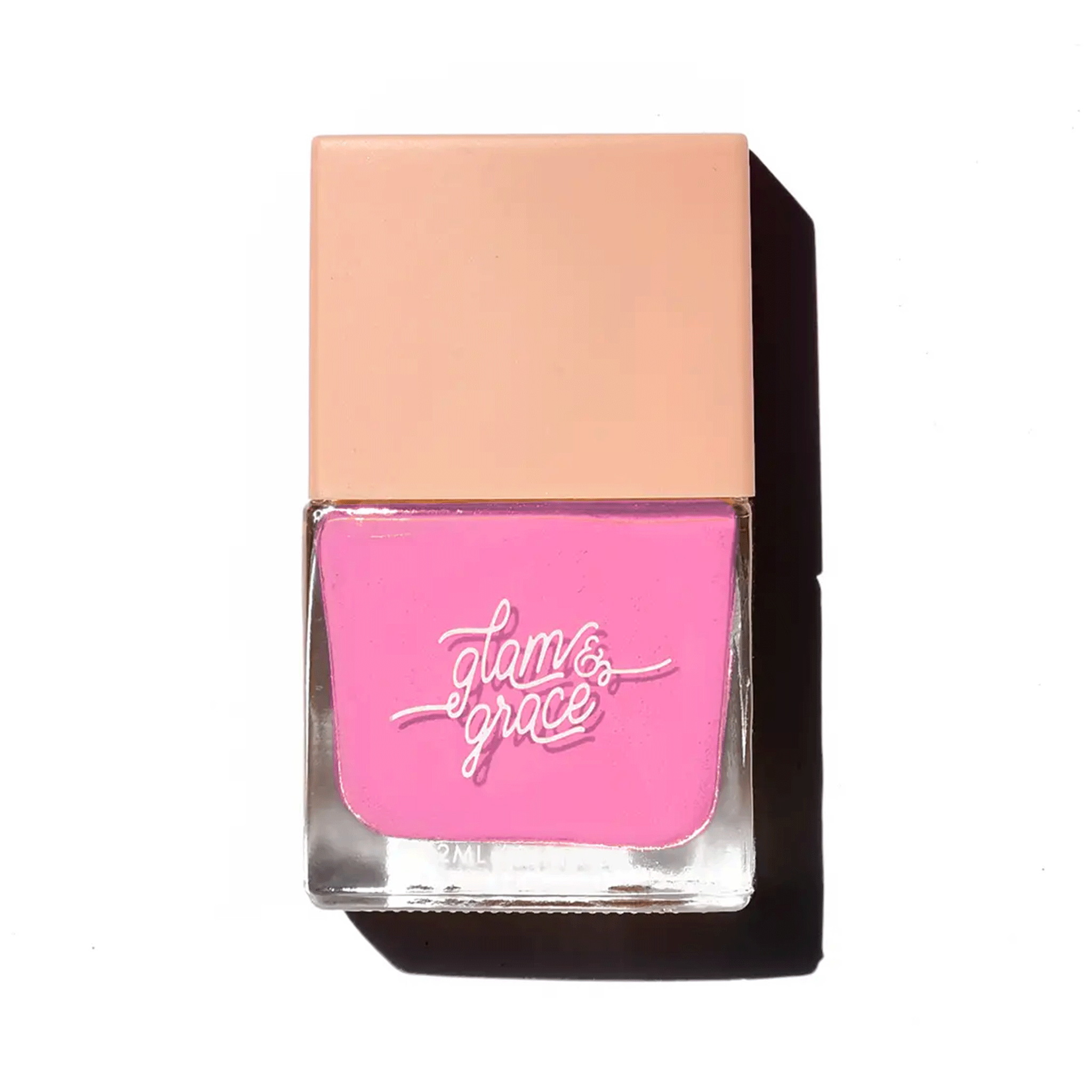 On a white background is a square nail polish bottle with a bright pink nail polish inside. 