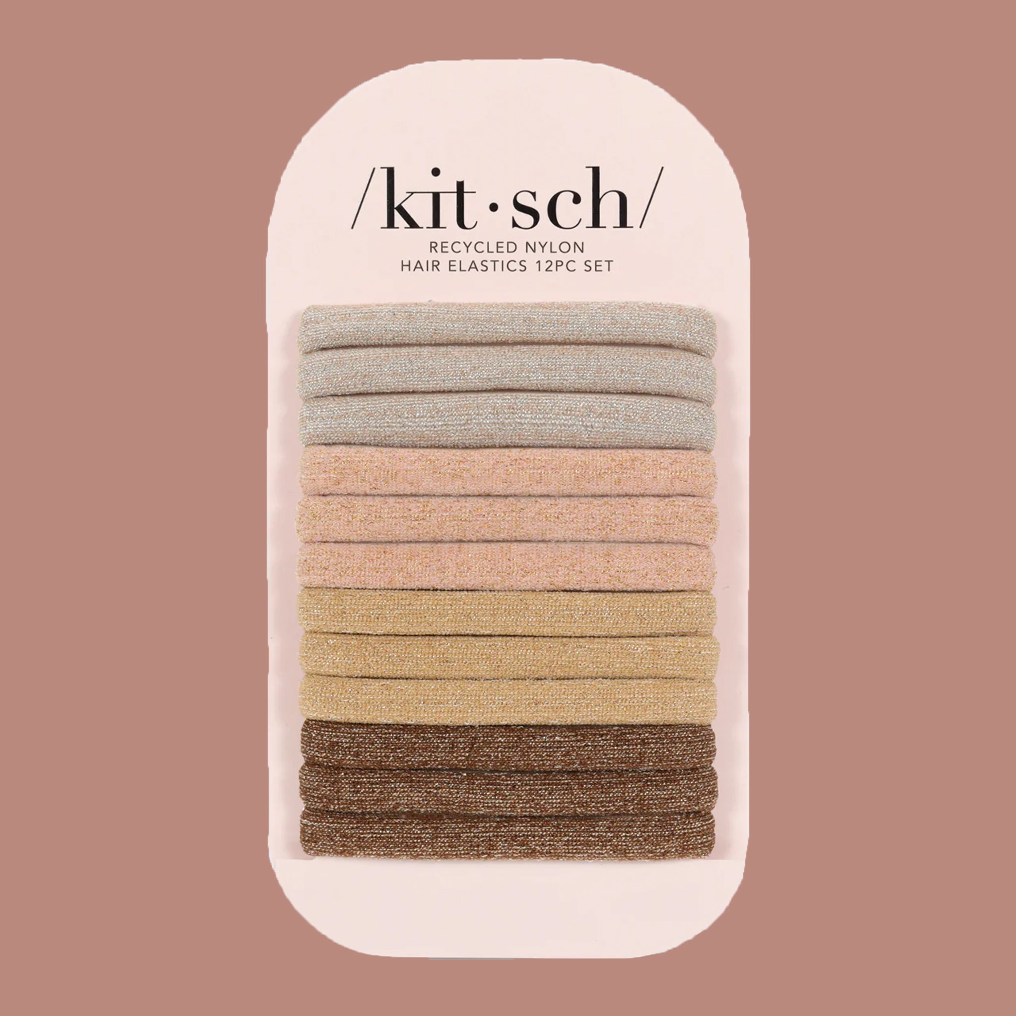 A stack of neutral elastic hair ties with a glitter finish. The colors range from a neutral tans, brown, and grey. 