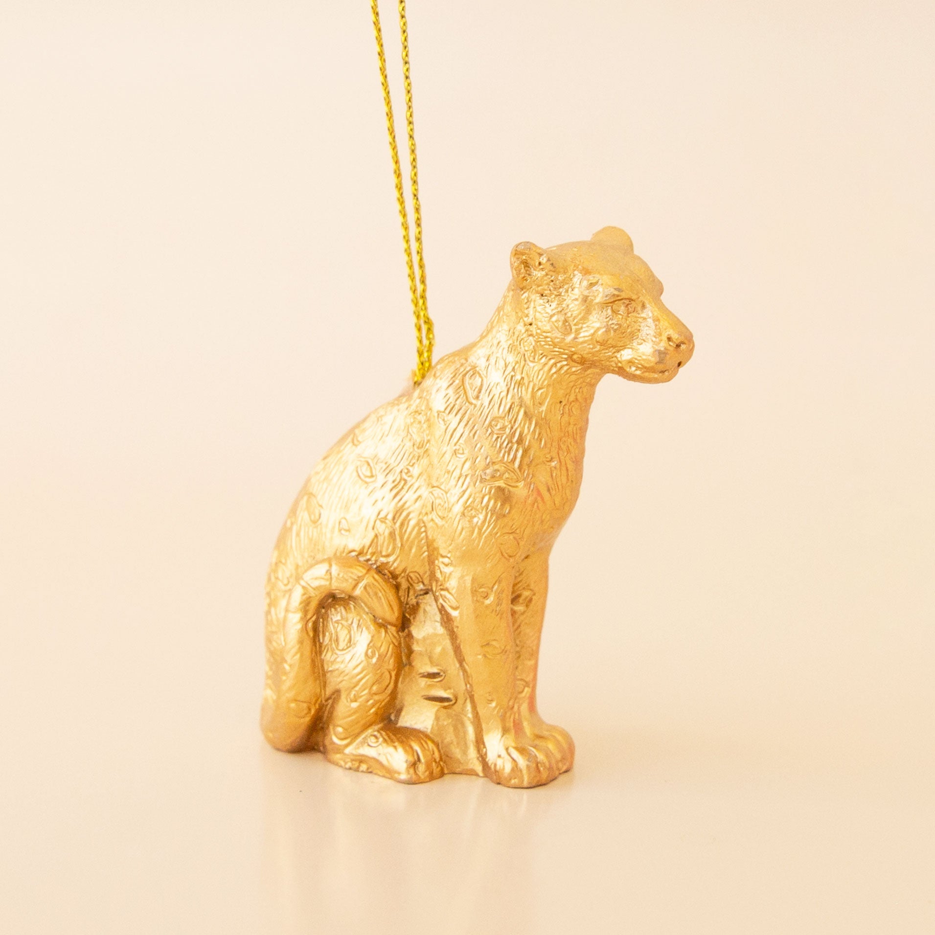 Gold sitting wildcat ornament. 