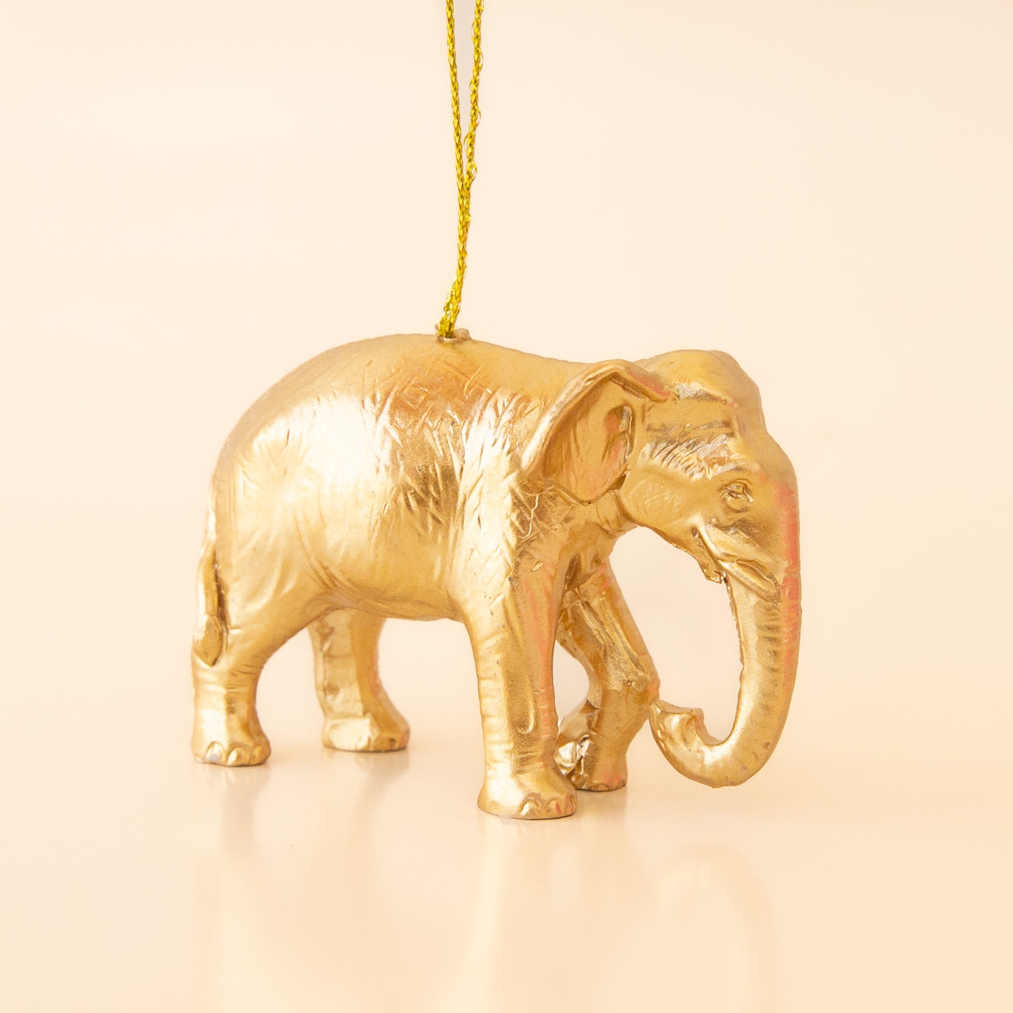 Gold standing elephant ornament. 