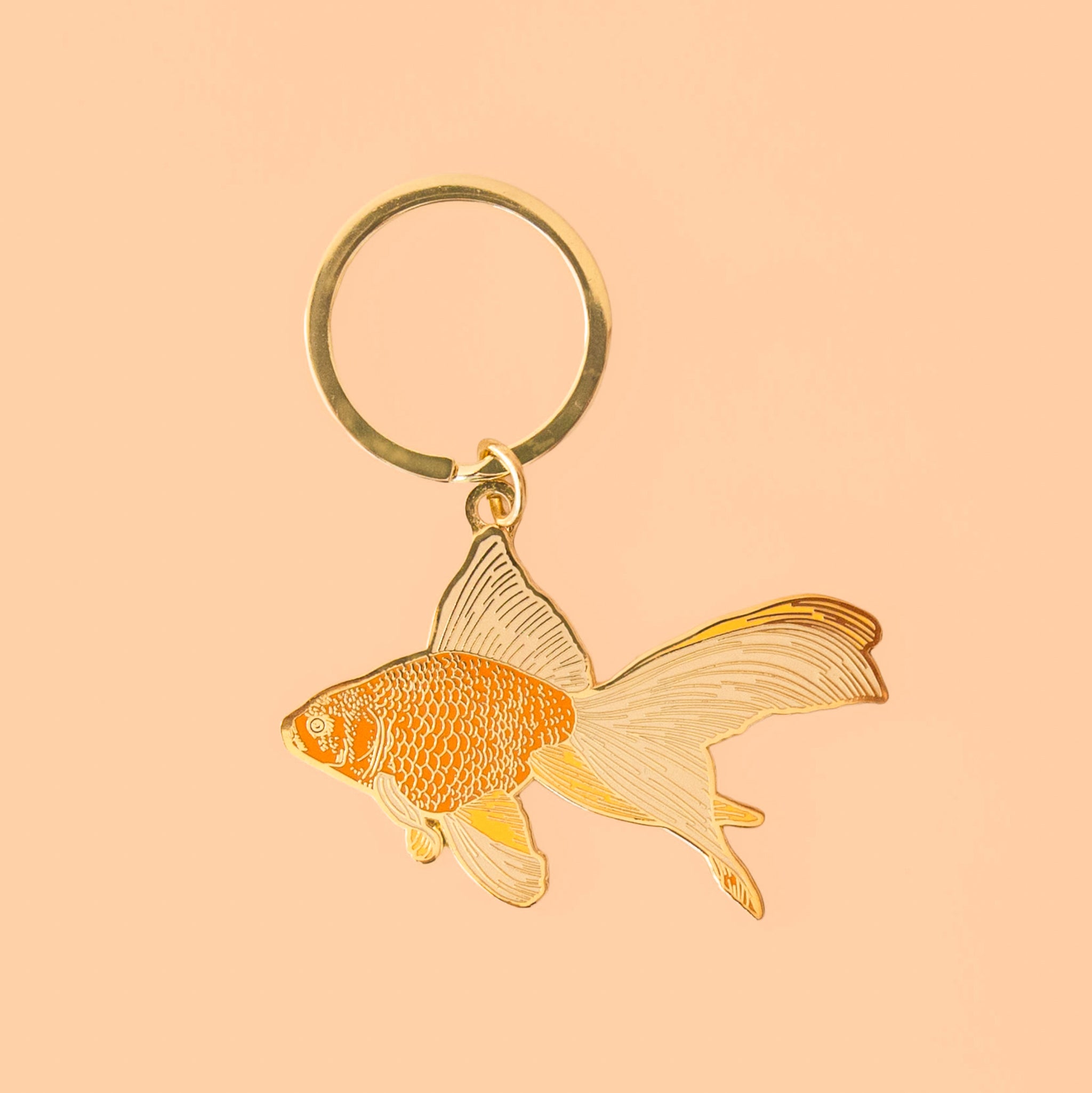 A gold goldfish keychain. 