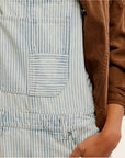 A blue and white striped pair of overalls. 