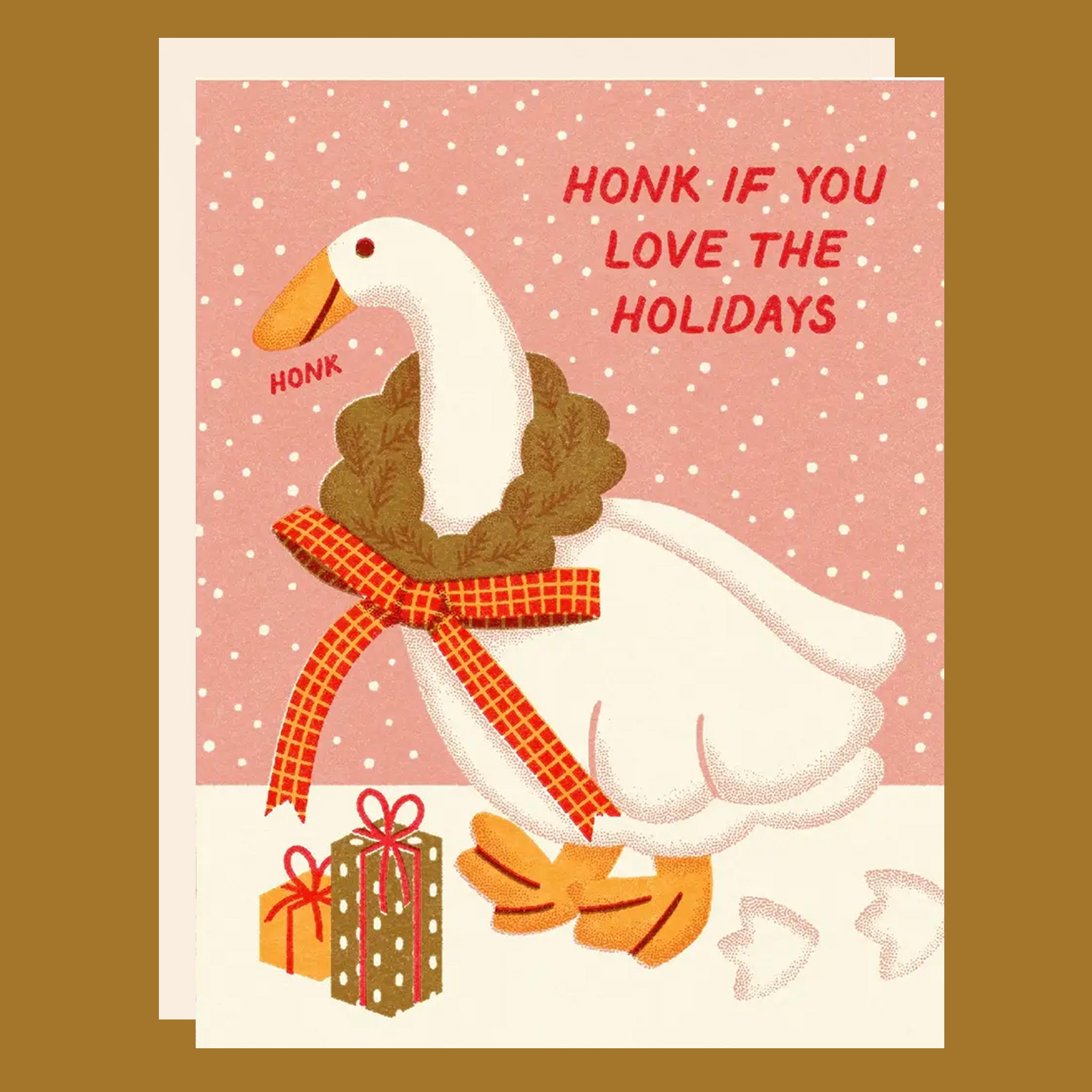 Christmas card with a goose wearing a wreath and scarf on a pink background. Honk if you love the holiday.