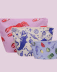 A set of three nylon packable pouches with a lobster print, a mermaid print and a sea creature print. 