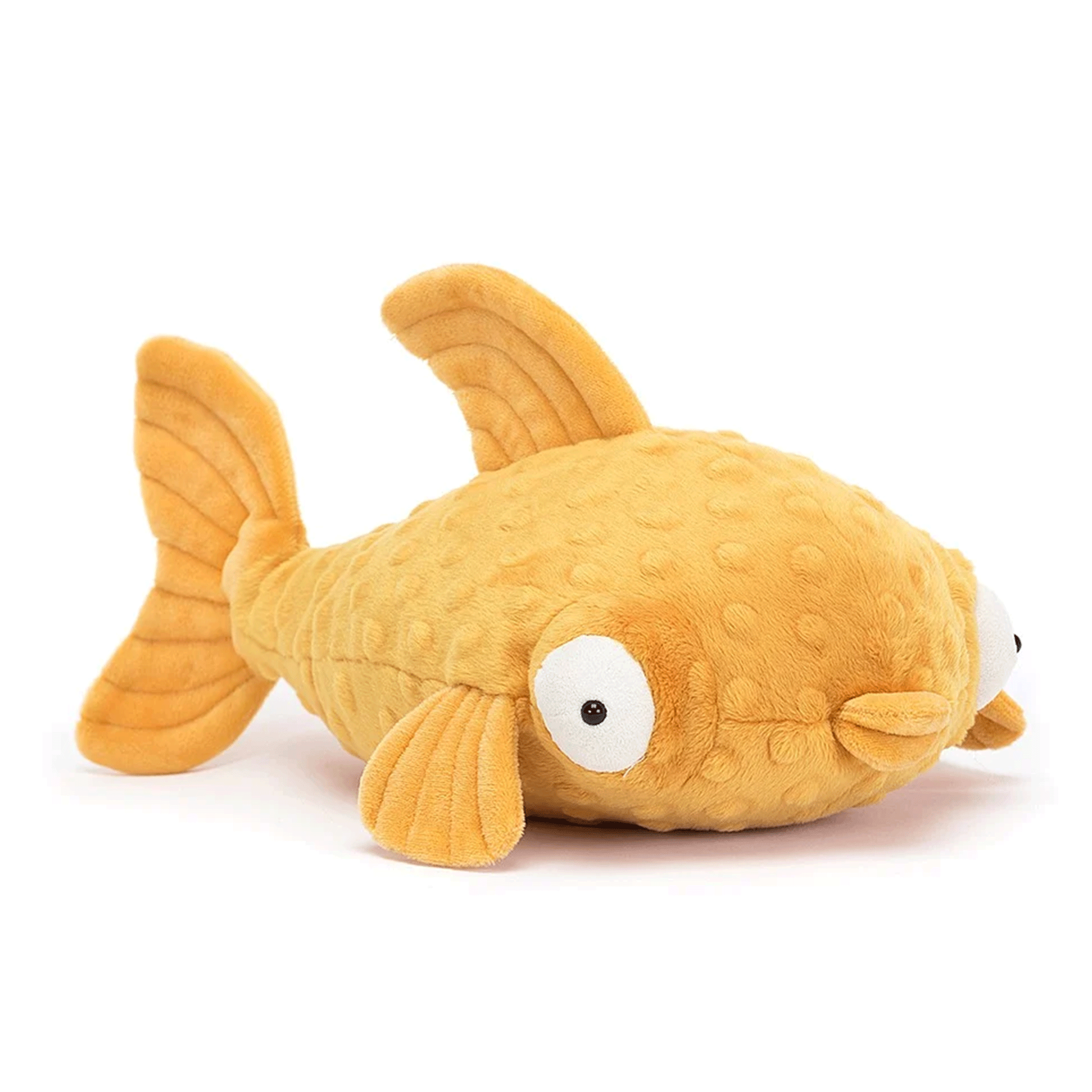 On a white background is a yellow stuffed toy fish with puffy eyes and lips. 