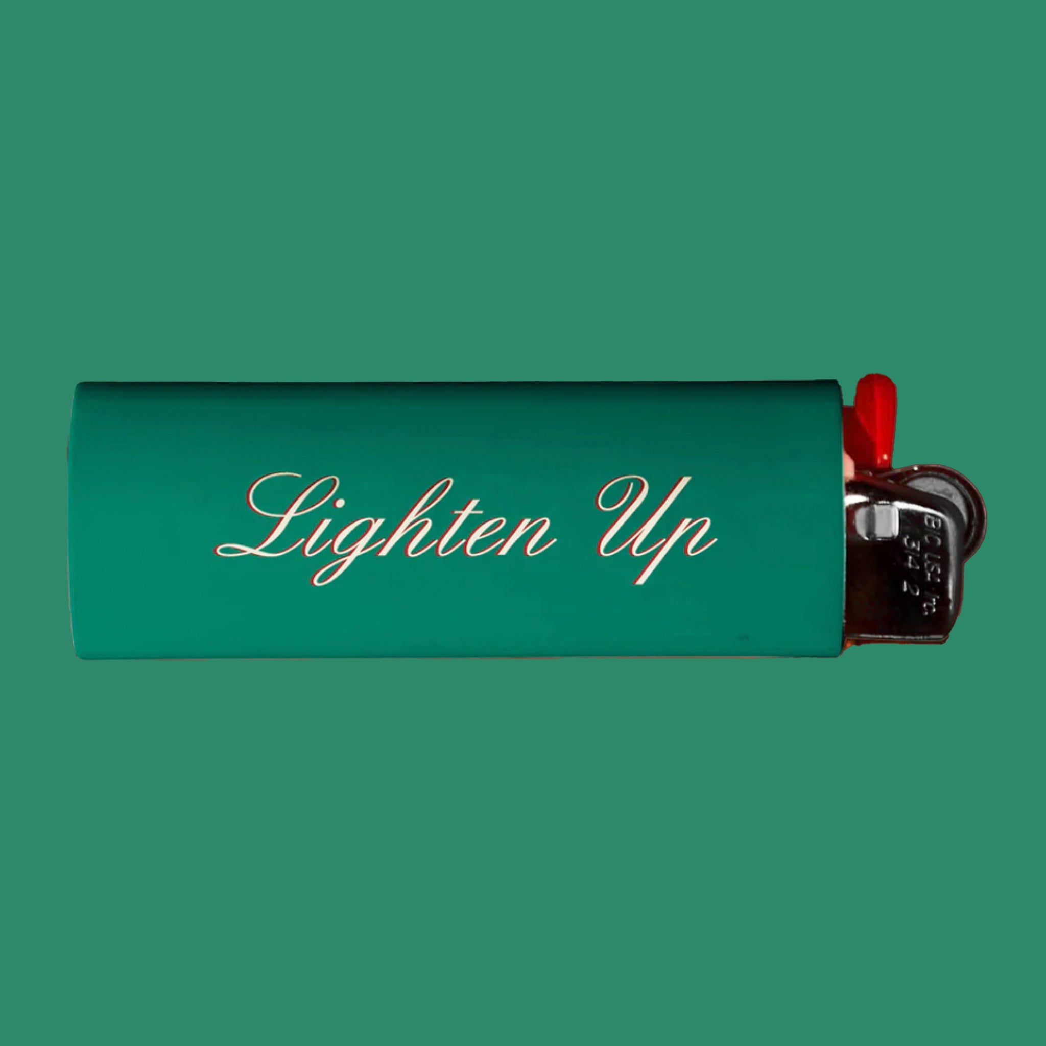 A green lighter with "Dad Grass" on one side and "Lighten Up" on the other.
