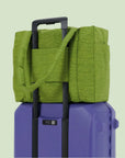 A green puffer carry on tote bag. 